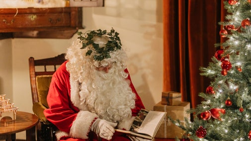 Father Christmas reading a book at Sunnycroft, Shropshire